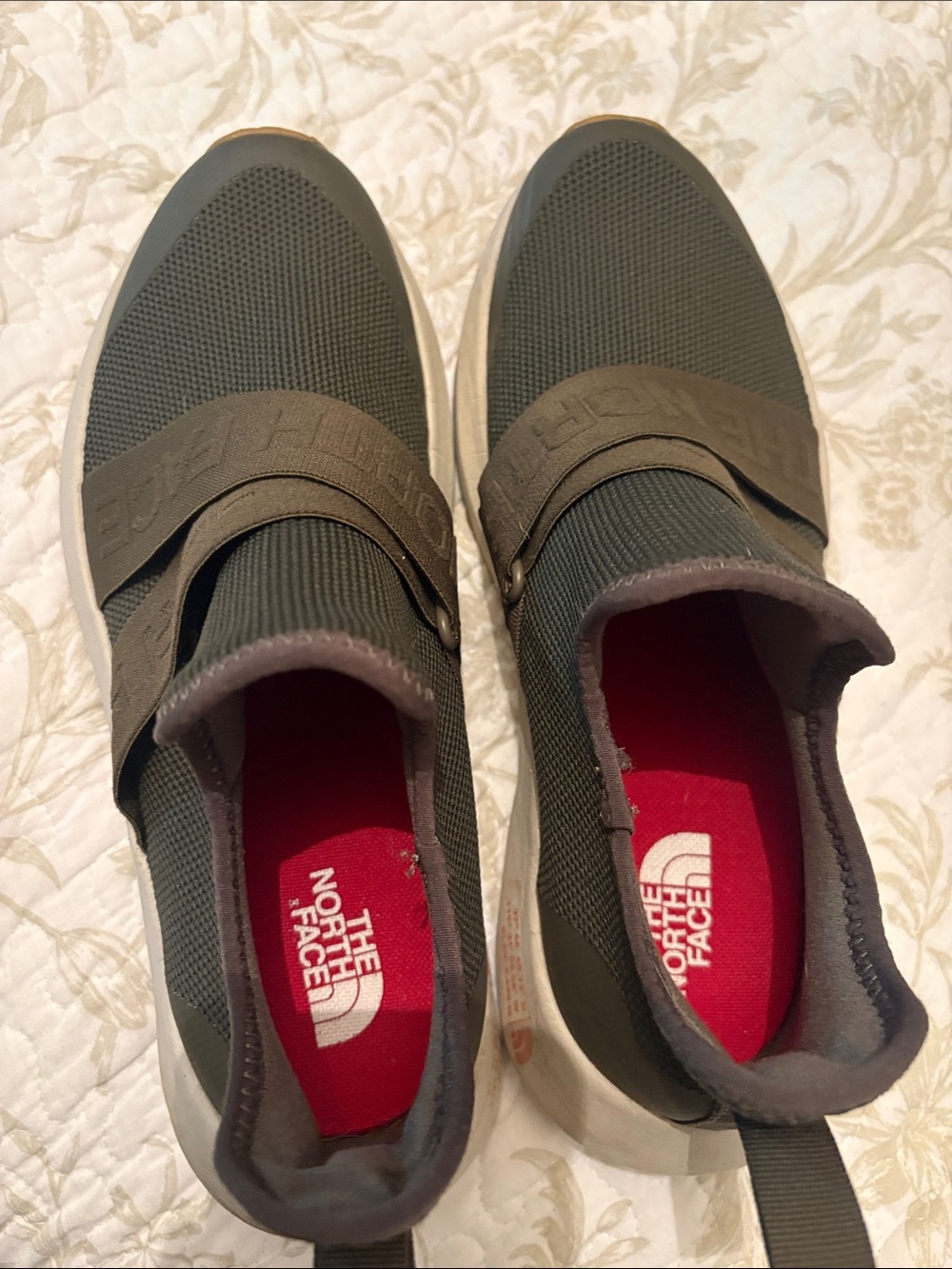 The North Face women’s Olive Green Slip-Ons with Red Insole